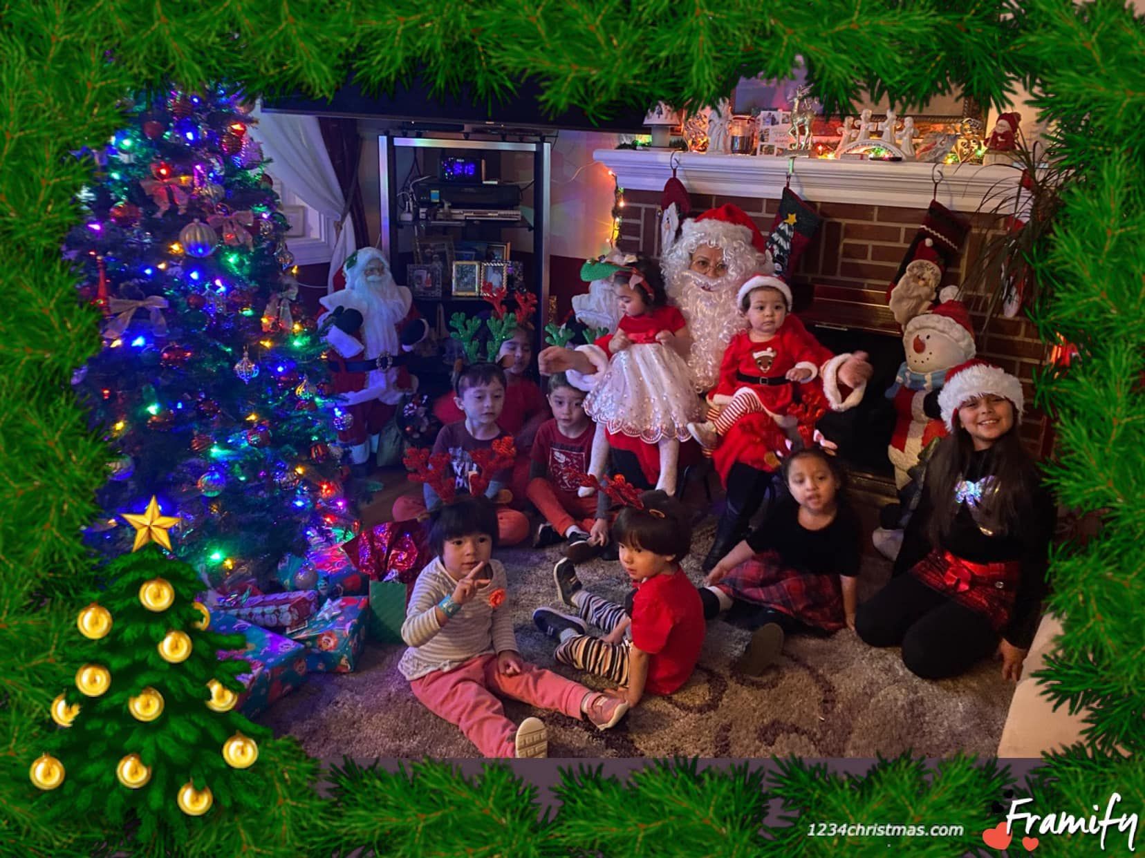 Children in Santa hats gathered by a decorated Christmas tree and fireplace with stockings and lights