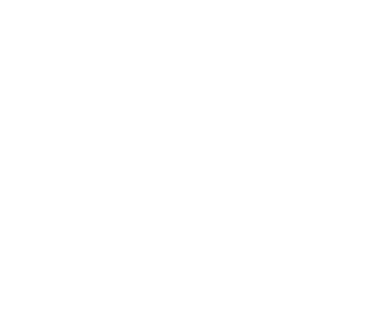 A close-up view of a metal gear-shift lever with a leather boot inside a vehicle cabin.