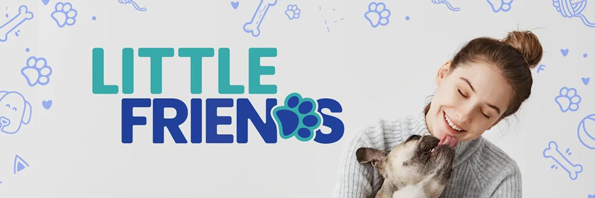 A person smiling while being licked by a small dog next to the text
