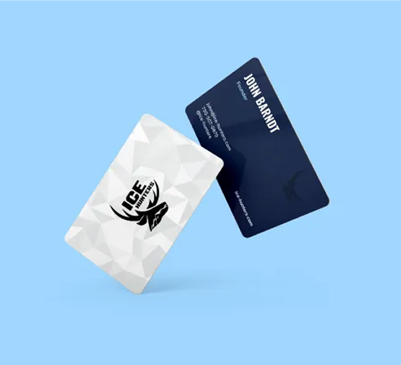 Two business cards, one white with a geometric pattern and logo, the other dark blue with text