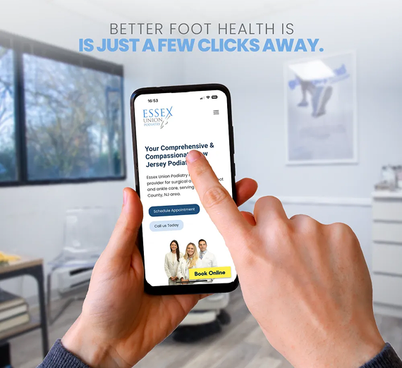 Hands holding a smartphone displaying the Essex Podiatry website with a
