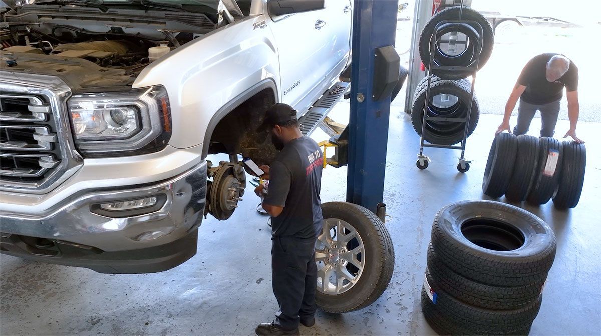 Brake disc and pads inspected during brake repair service at Big 10 Tire Pros