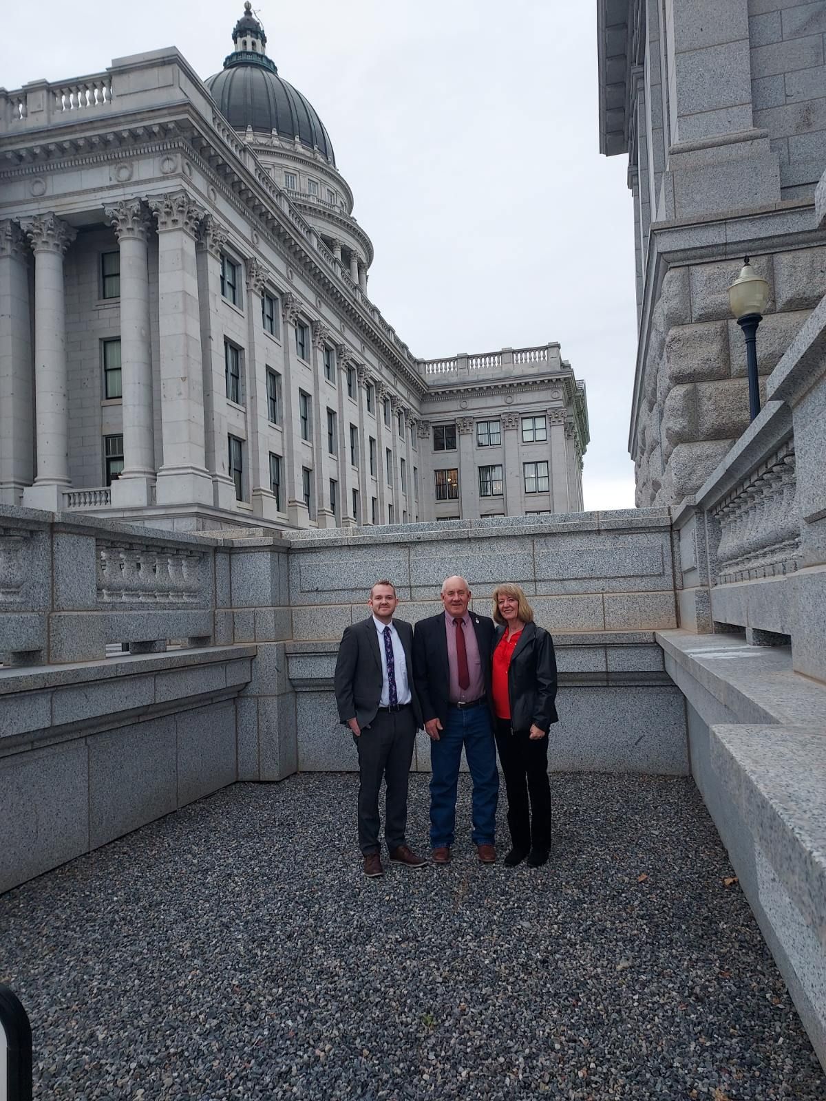 Photograph: Commisioner Scott Johnson, CarolLee Johnson, Archivist Director, and McKay Chaimberlain
