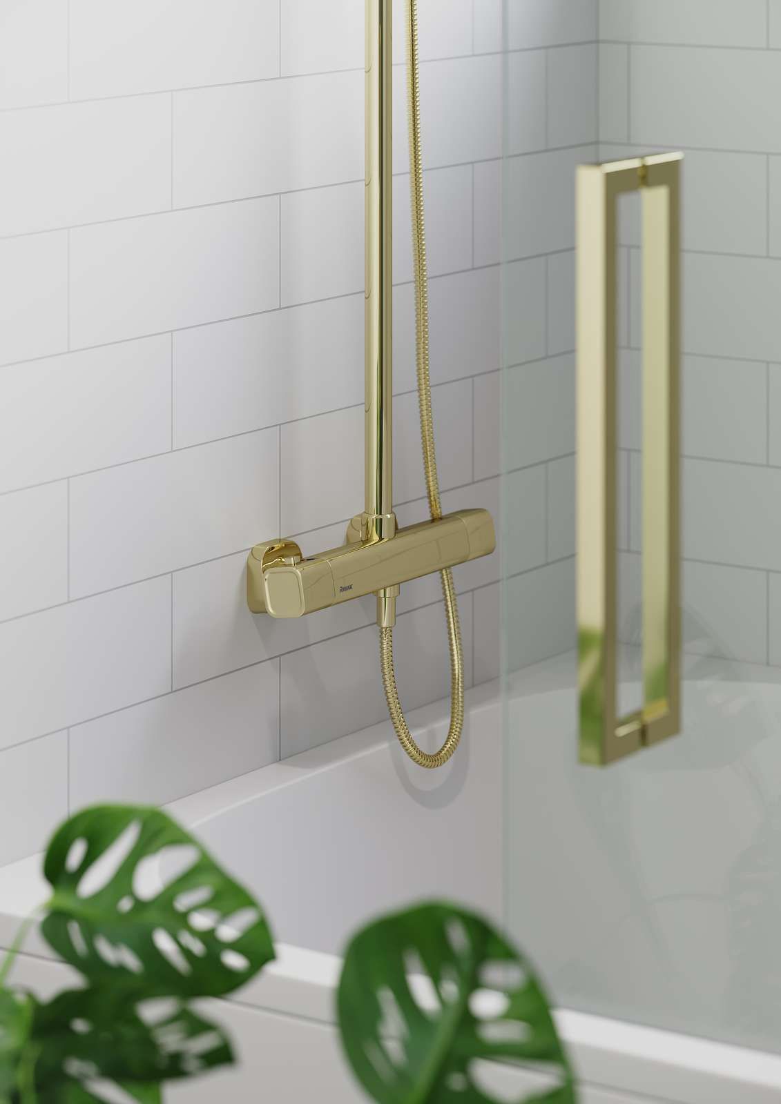 Gold shower fixtures and glass door in a white-tiled bathroom, with a green plant in the foreground.