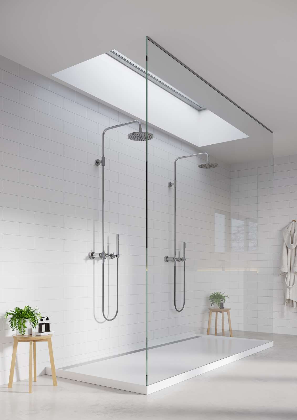 Modern shower with two shower heads, glass walls, white tile, and a skylight.