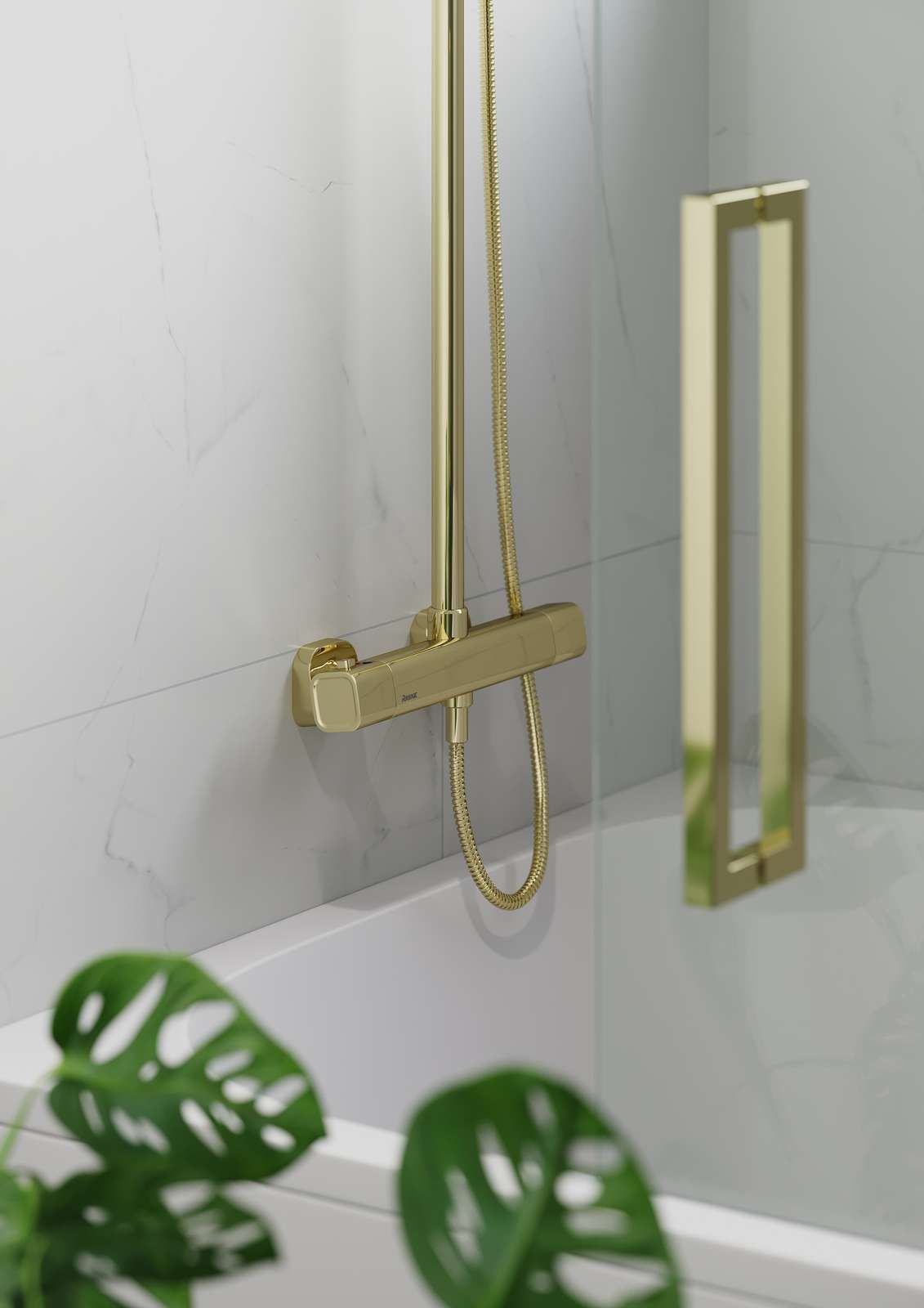 Gold shower fixture and glass door in a bathroom with white marble tile. Green plant in foreground.