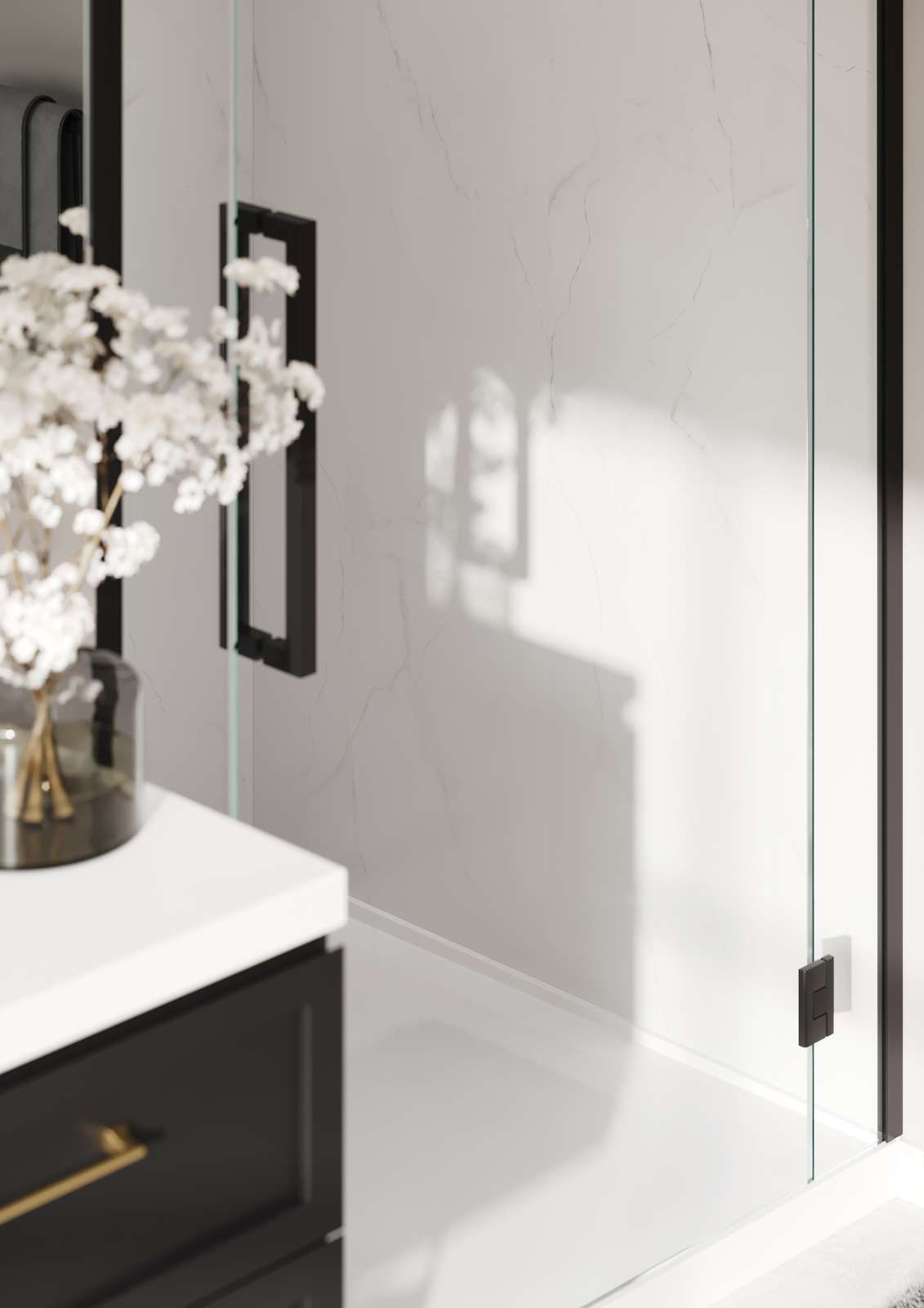 Modern bathroom with a glass shower door and black trim.