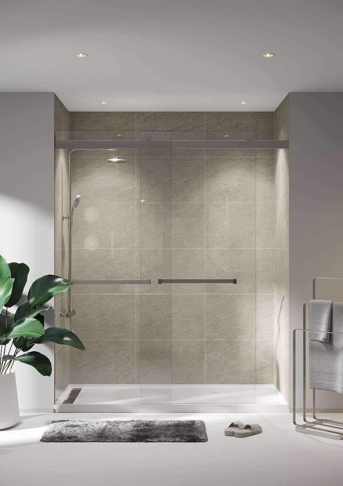 Walk-in shower with grab bars, gray tile, glass door, and towels on rack in a modern bathroom.