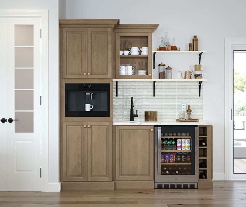 Small built-in kitchen area with coffee maker, shelves, cabinets, sink, and mini-fridge.