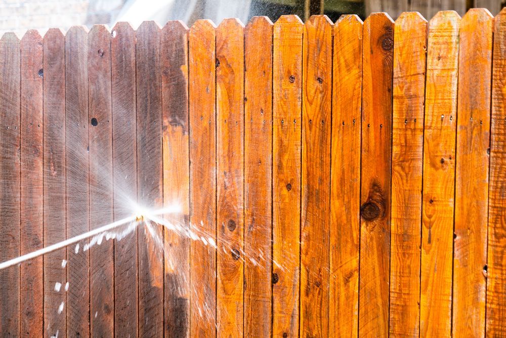 Pressure Washing a Wooden Fence — Coastal Pressure Solutions in Runaway Bay, QLD