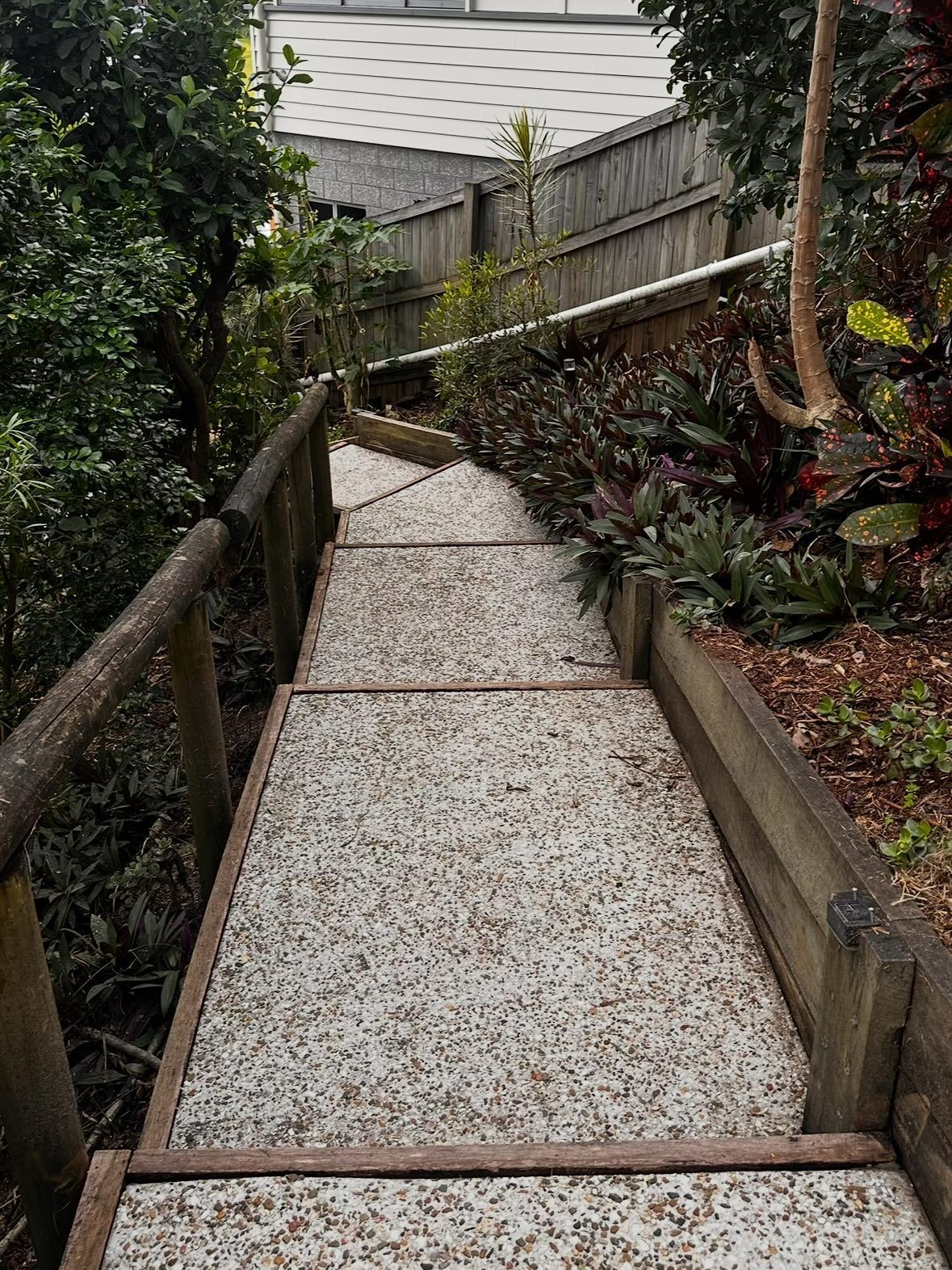 A Set of Outdoor Stairs With Speckled Concrete Treads — Coastal Pressure Solutions in Oxenford, QLD