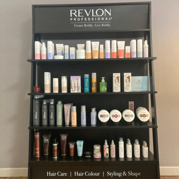 styling-products-on-four-black-shelves.