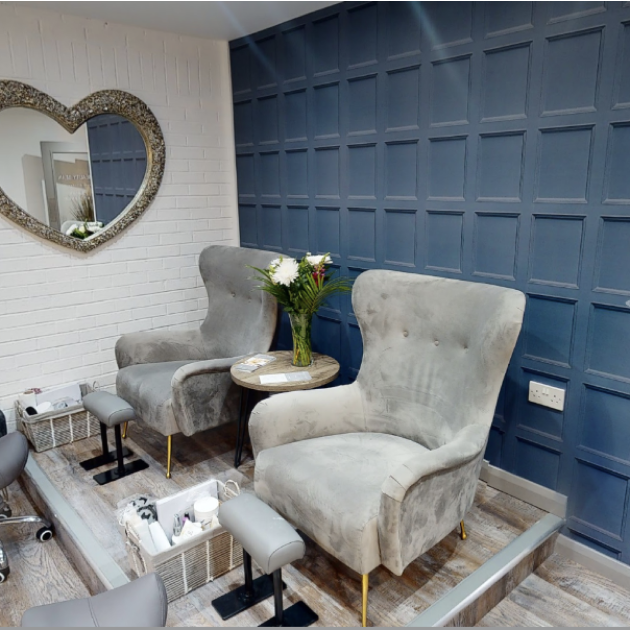 two-grey-upholstered-wingback-chairs