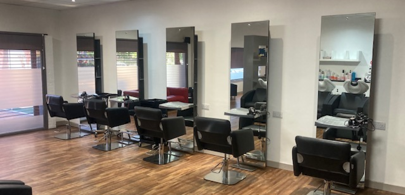 a-hair-salon-with-five-black-styling-chairs