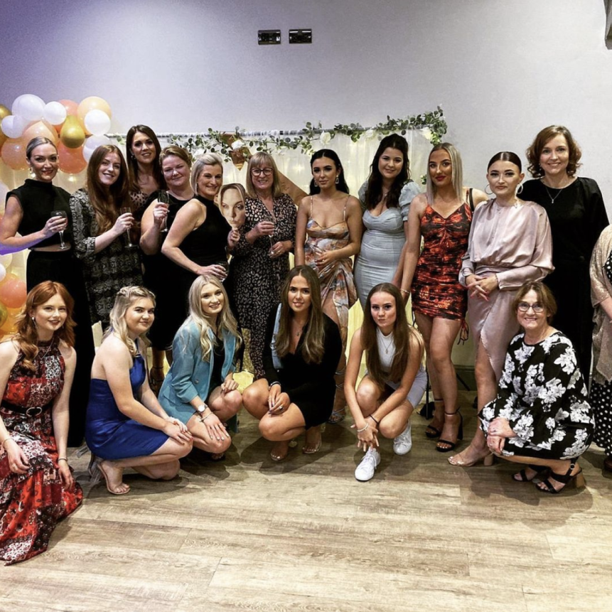 group-of-people-posing-for-a-photo-indoors