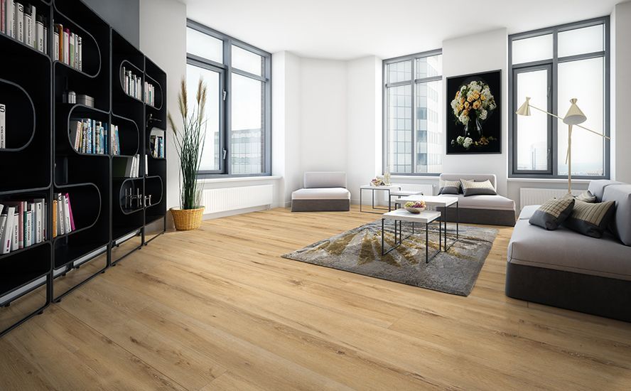 Fan of assorted wood laminate samples on a wooden surface