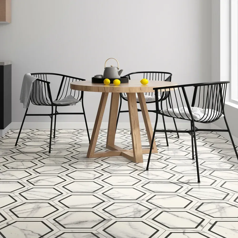 Modern dining area with a wooden table, black chairs, and geometric black-and-white tiled floor