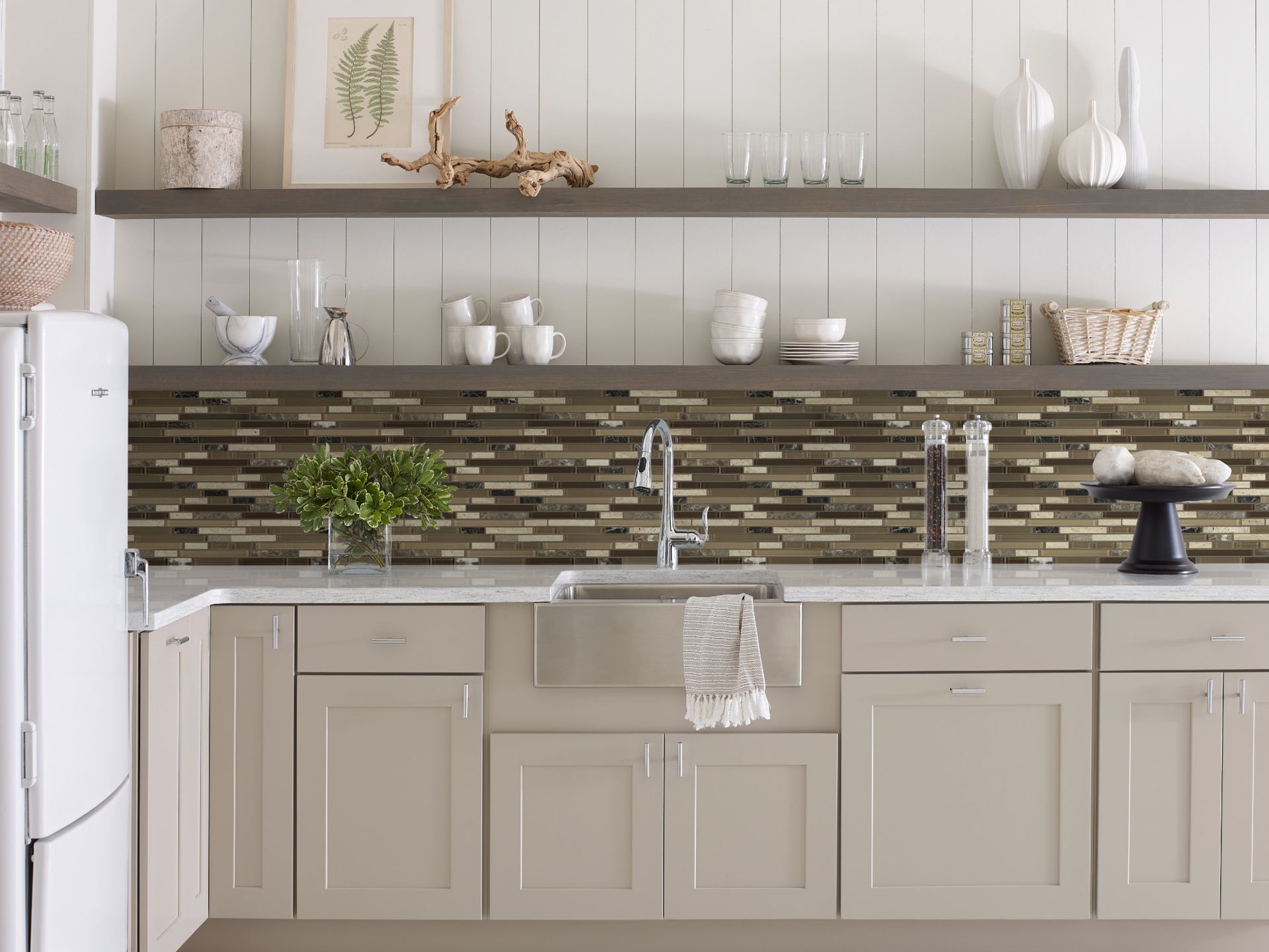 Modern kitchen with beige cabinets, open shelves, tiled backsplash, and a sink under a window.