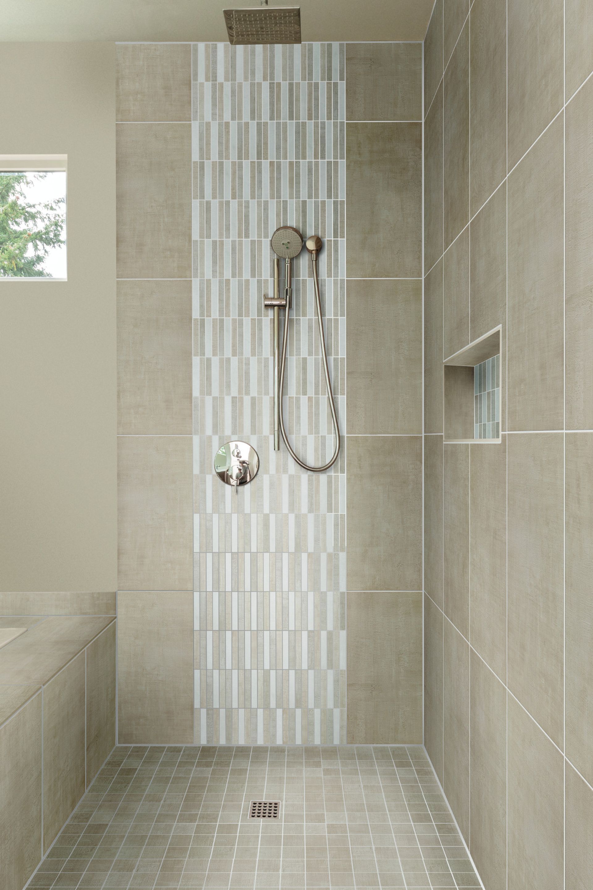 Modern tiled walk-in shower with rainfall showerhead and built-in shelf