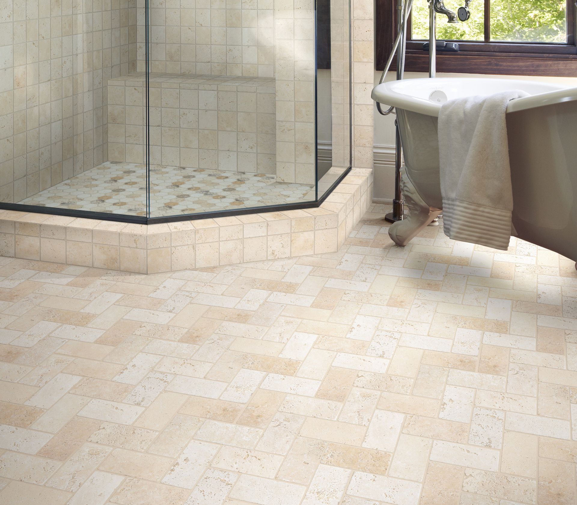 Bathroom with tiled walk-in shower, bathtub, and beige stone floor near a window