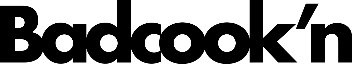 Black bold wordmark reading “Badcock'n” on a white background.