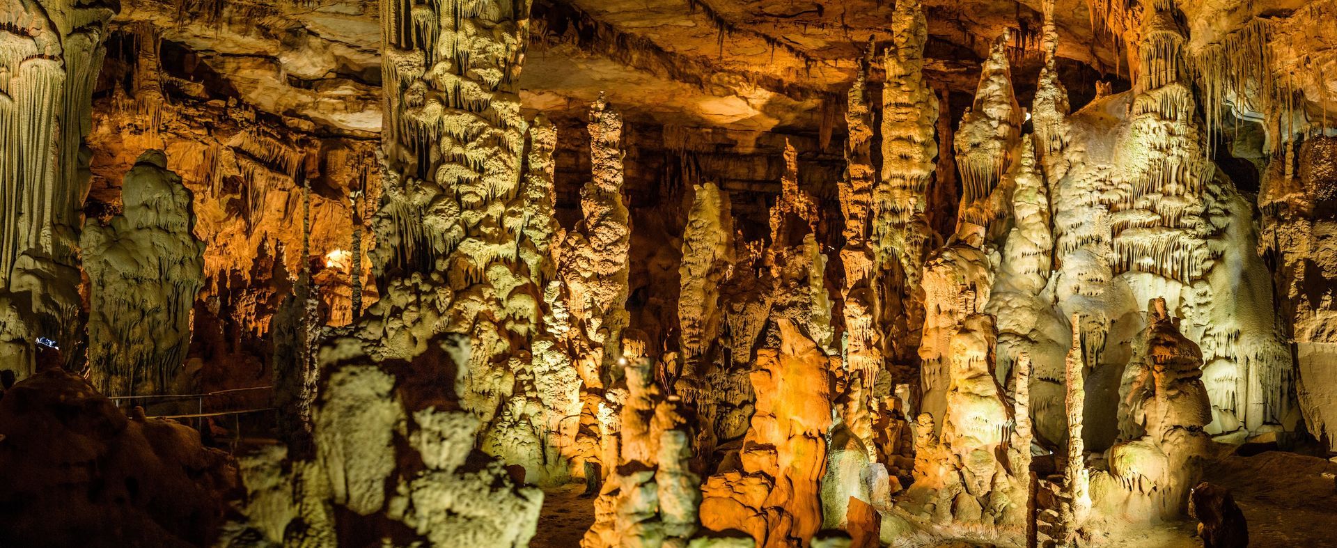 A large cave filled with lots of rocks and formations.