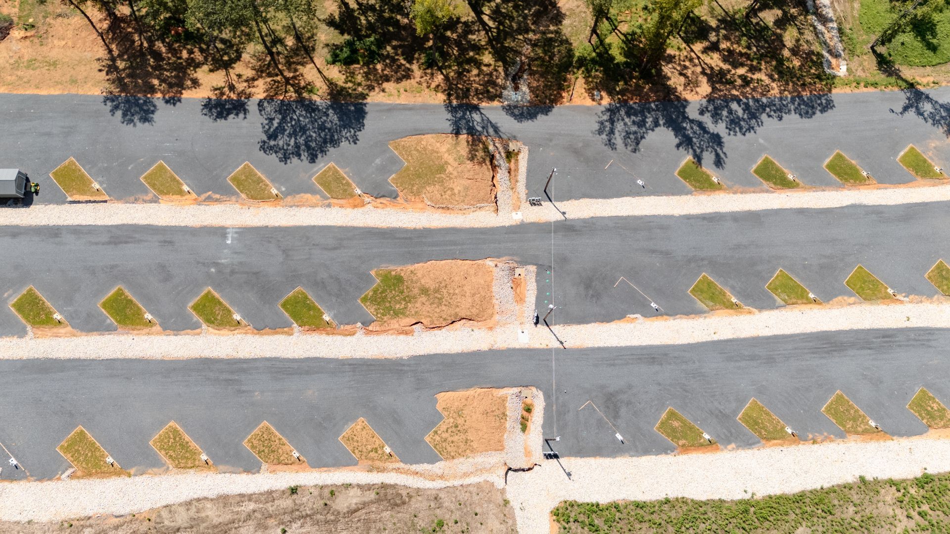An aerial view of a residential area with lots of parking spaces