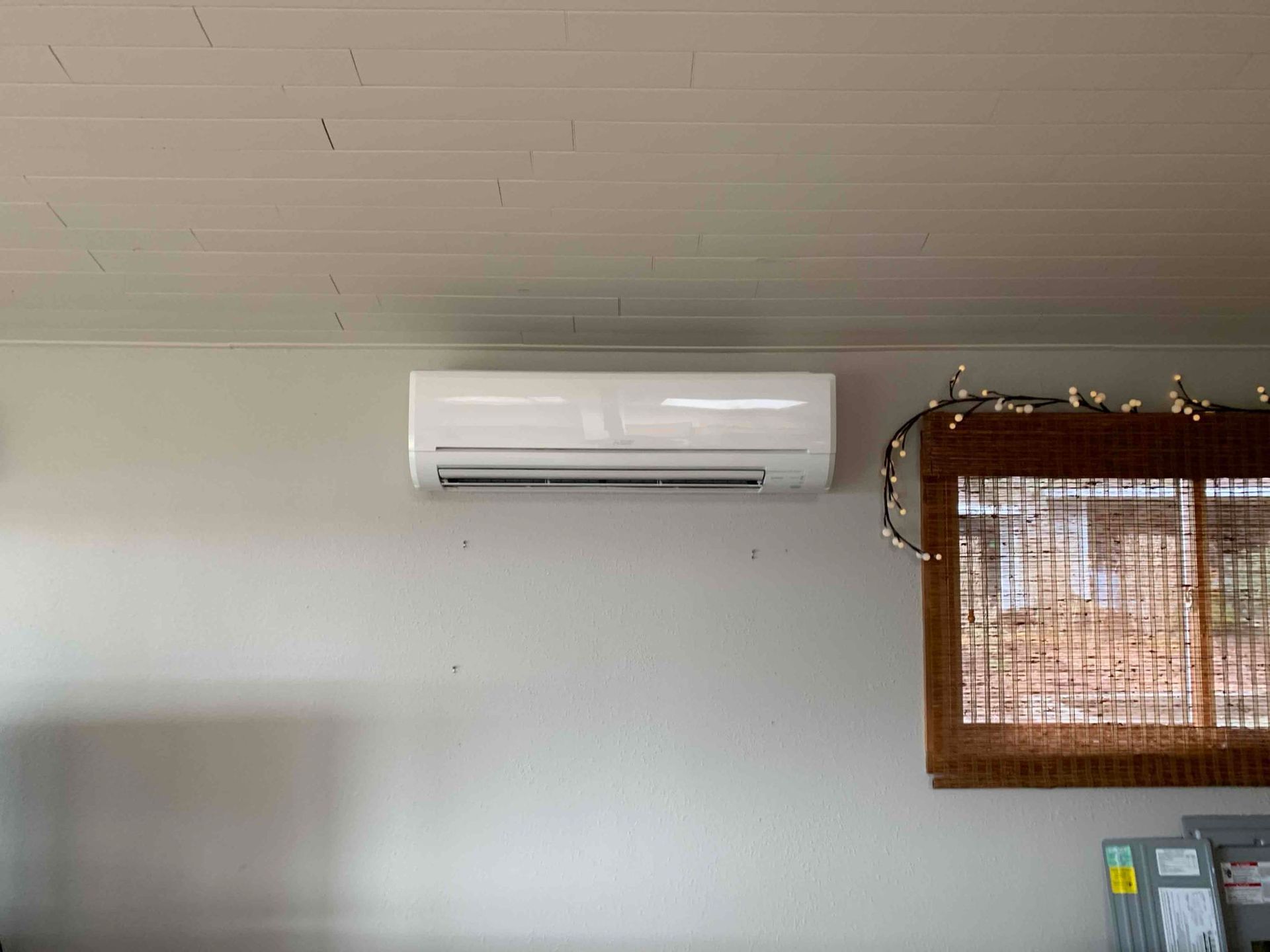 HVAC technician installing ductless mini-split system