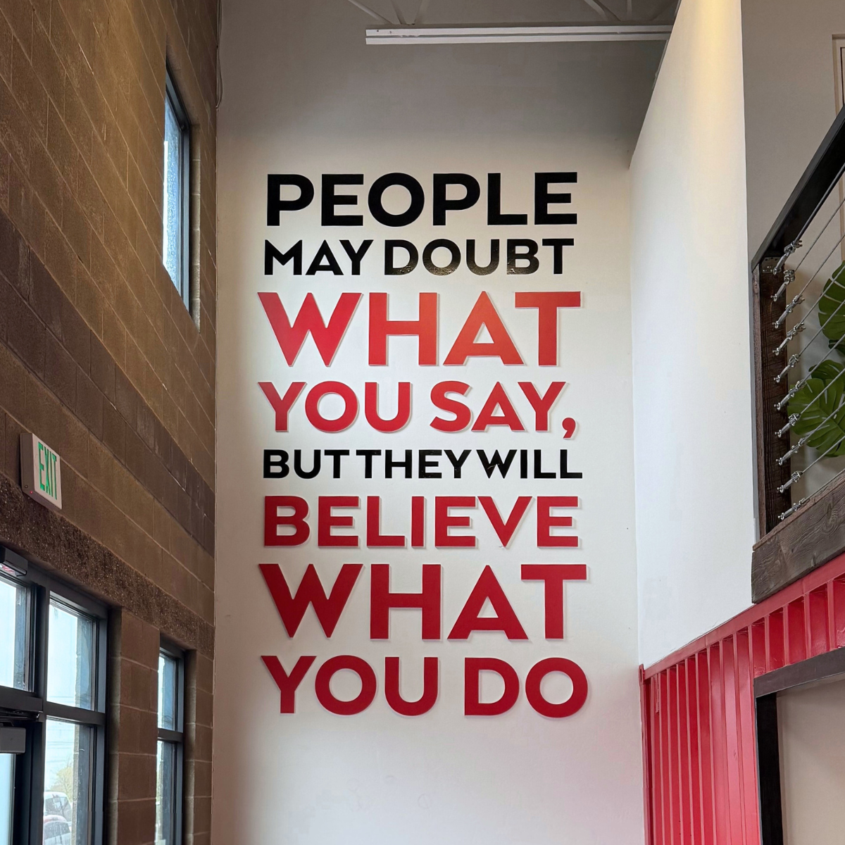 Text on a white wall: