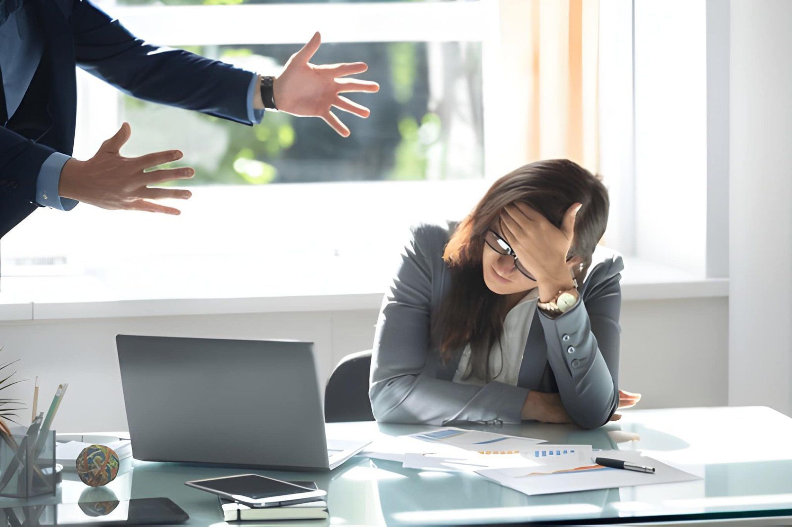 Employee Showing a Person Gesturing With Both Hands Toward a Colleague — Australian Employee Lawyers in Broadbeach Waters, QLD