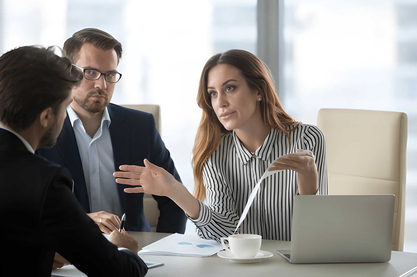 Three Professionals in a Bright Office Meeting — Australian Employee Lawyers in Broadbeach Waters, QLD