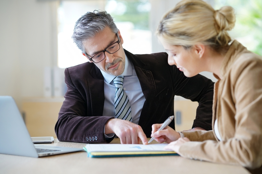 A Person in a Suit Points to a Document — Australian Employee Lawyers in Broadbeach Waters, QLD