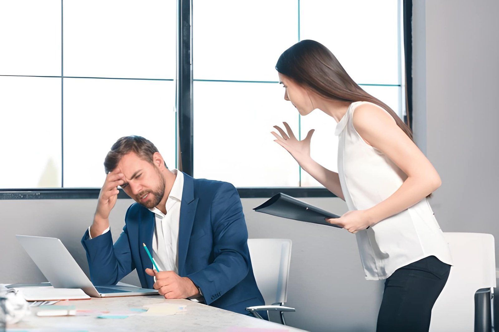Employee in a Suit Sits at a Desk Looking Stressed — Australian Employee Lawyers in Broadbeach Waters, QLD
