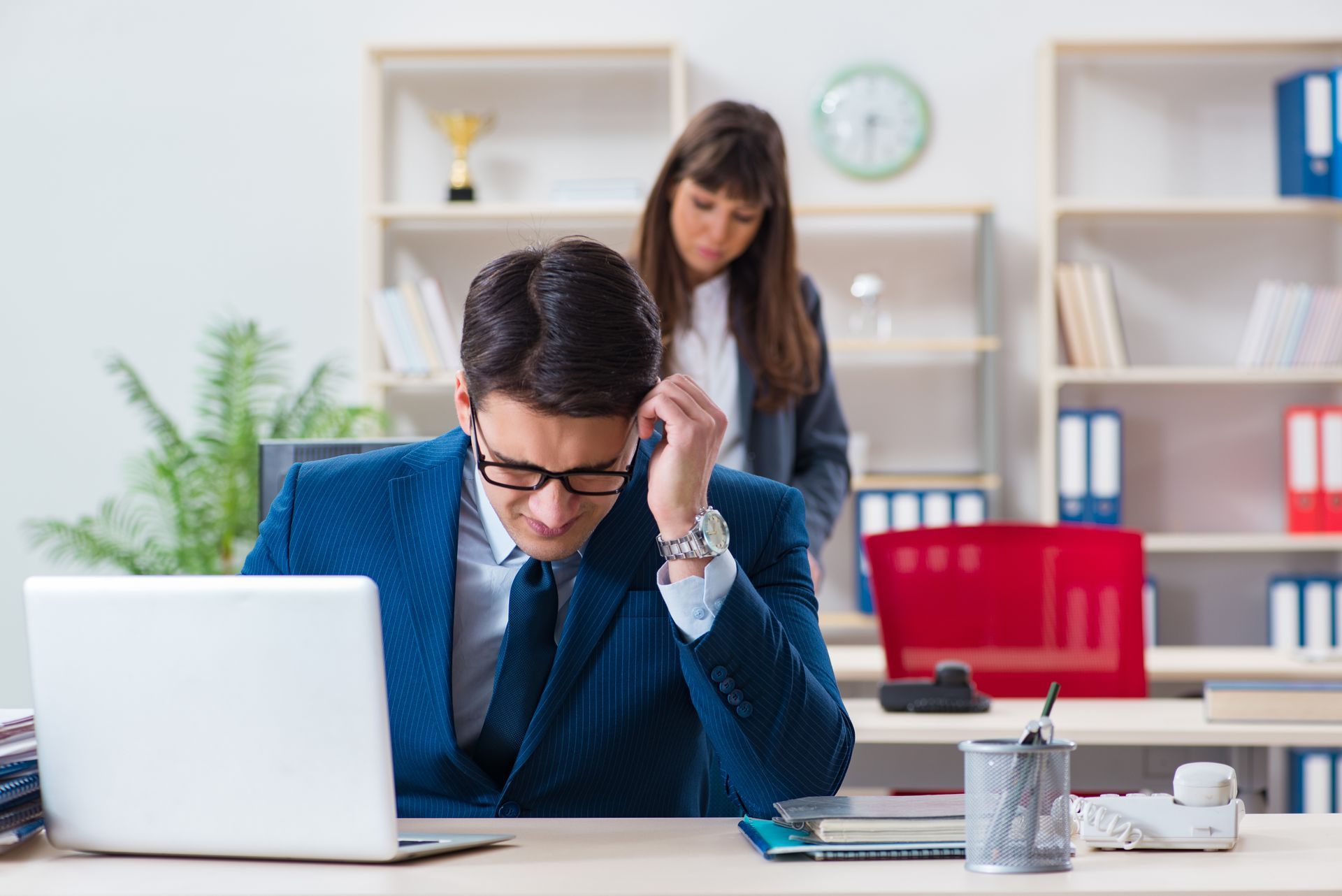 Employee Sits at a Desk Looking Stressed — Australian Employee Lawyers in Sunshine Coast, QLD