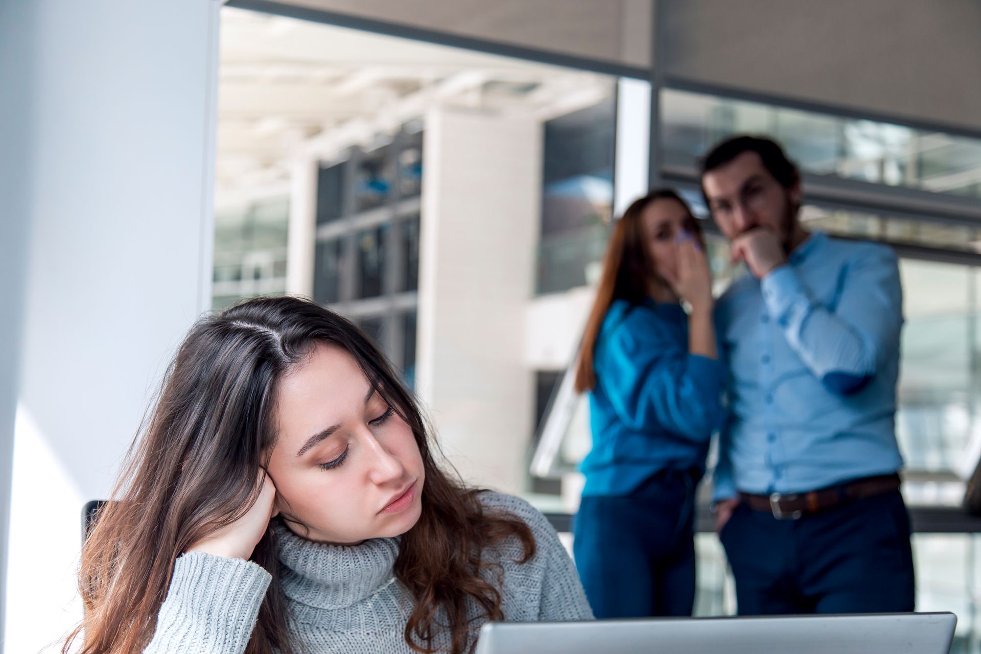 A Woman Sits at a Desk Looking Distressed — Australian Employee Lawyers in Sunshine Coast, QLD