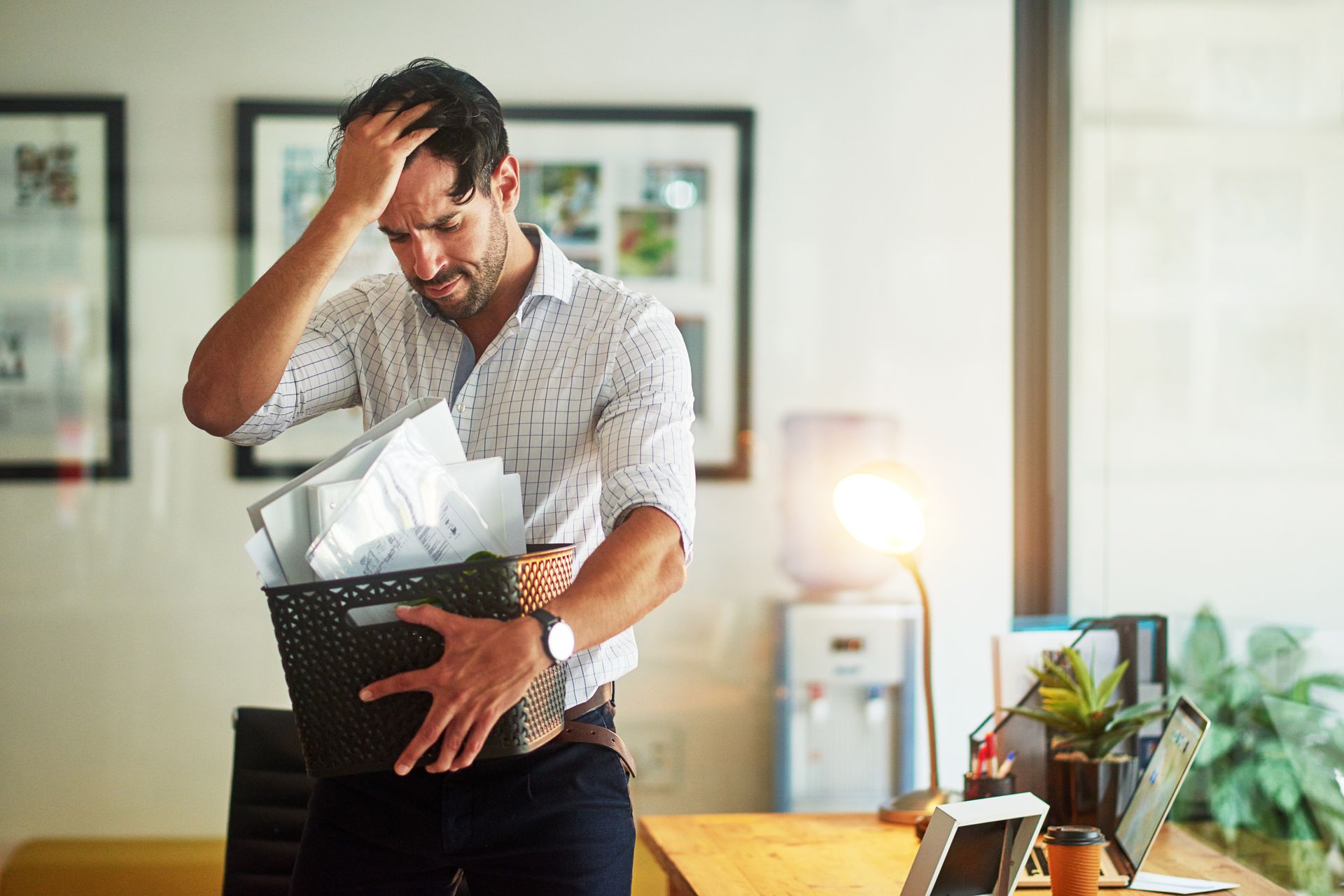 A Distressed Person Holds a Box of Office Belongings — Australian Employee Lawyers in Broadbeach Waters, QLD