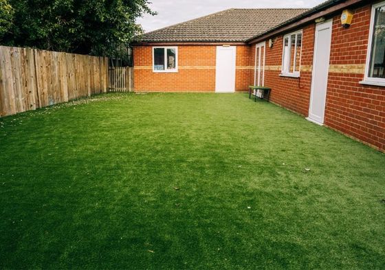 Artificial grass in back garden in Whittlesey, Peterborough