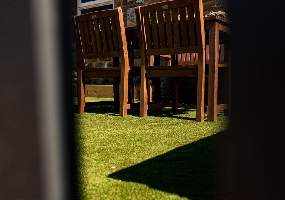 After installation of artificial grass a café in installation of artificial grass a café in Yaxley, Peterborough