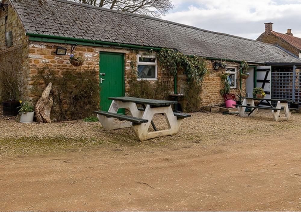 Before installation of artificial grass a café in Yaxley, Peterborough