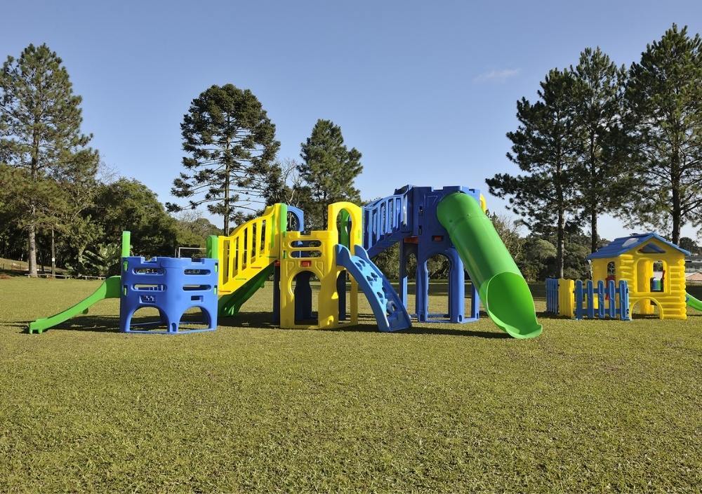Yaxley nursery playground with artificial grass underneath climbing frame