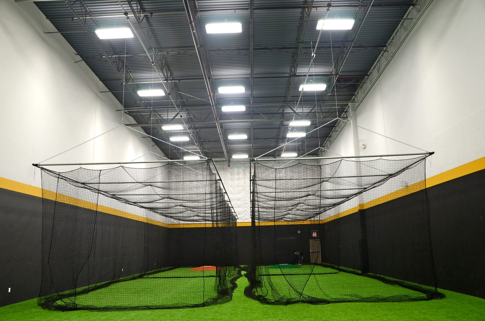 Crew installing synthetic sports turf at a training facility