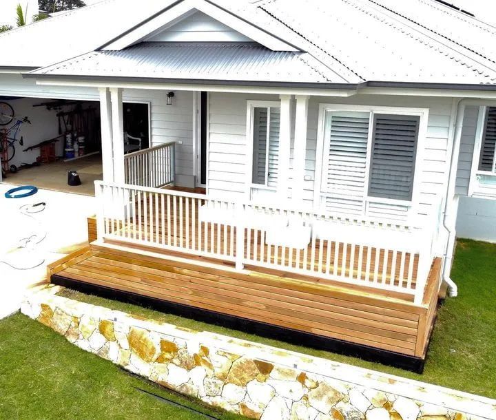 A White House With a Wooden Deck and a White Railing — Better Built Patios & Decking in Wollongbar, NSW
