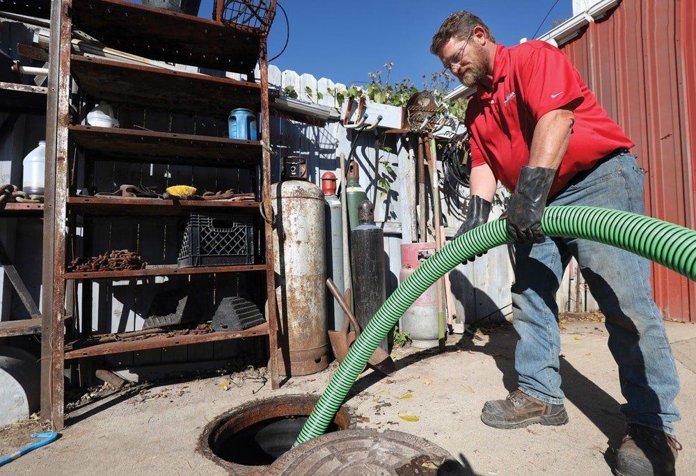 Man Holding Hose | Lake Orion, MI | Turner Sanitation Man Holding Hose | Lake Orion, MI | Turner Sanitation
