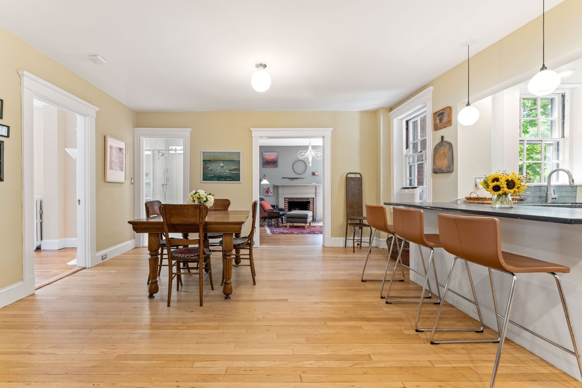 Dining area, kitchen island bar and view to living room