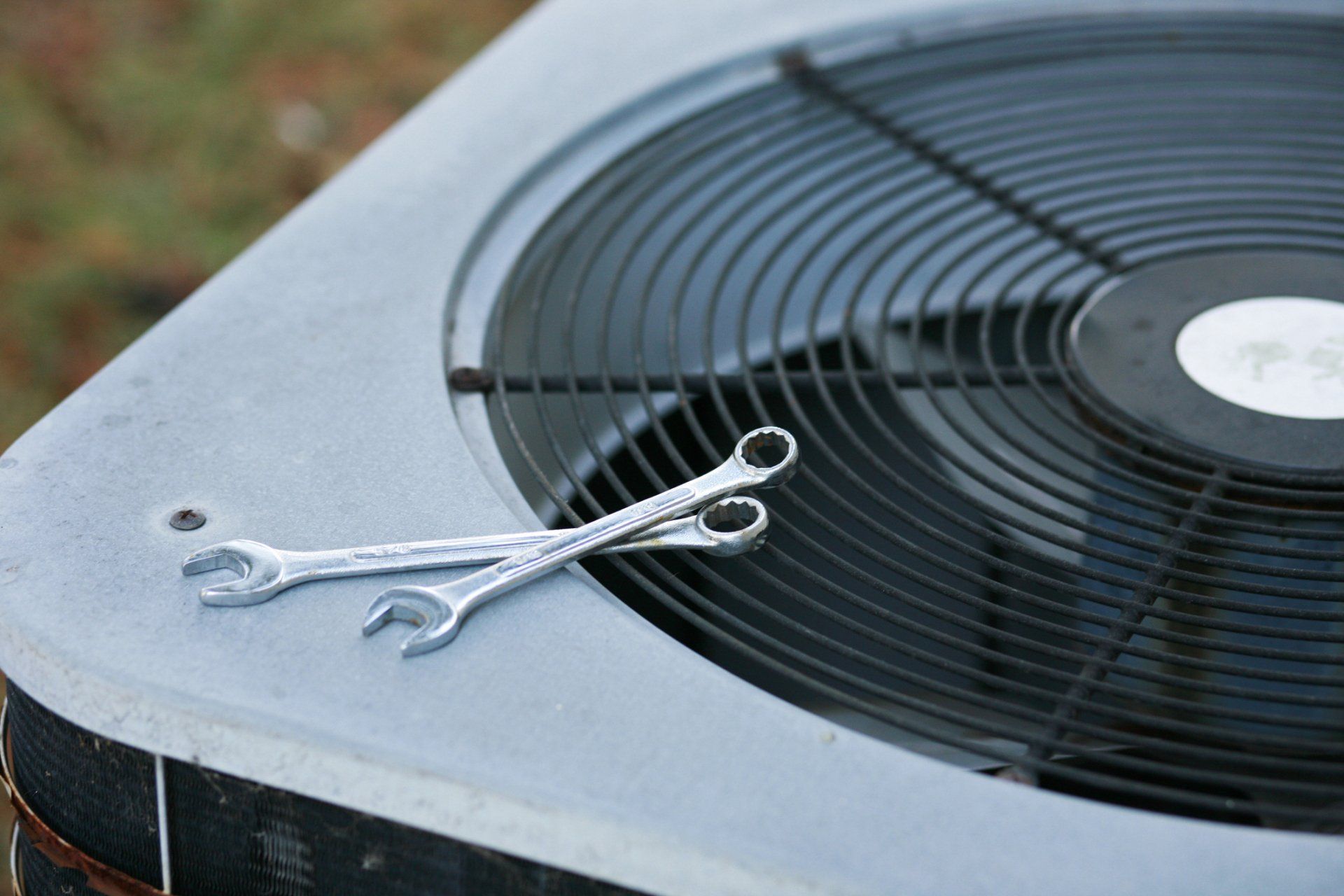 An Air Conditioner Being Fixed - Palmetto, GA - Hearn Heating and Air