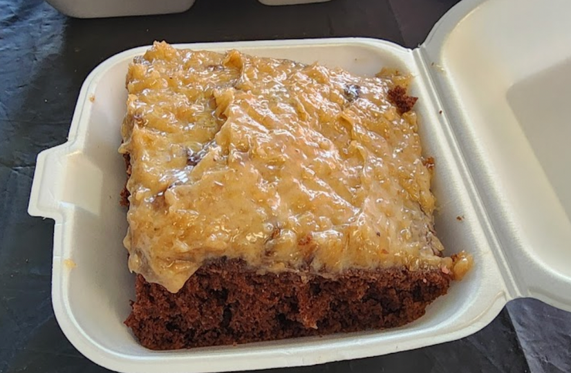A piece of cake in a styrofoam container