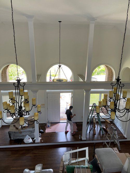 Man Painting The House Interior — Lexington, KY — Hardin Painting Company