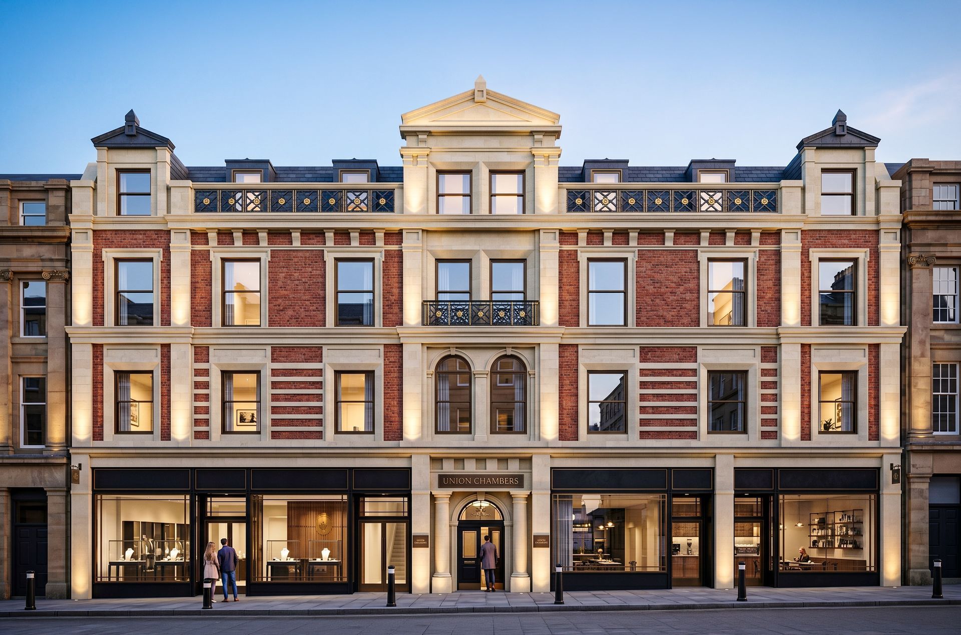 Elegant historic brick building with white stone trim and large storefront windows at street level.