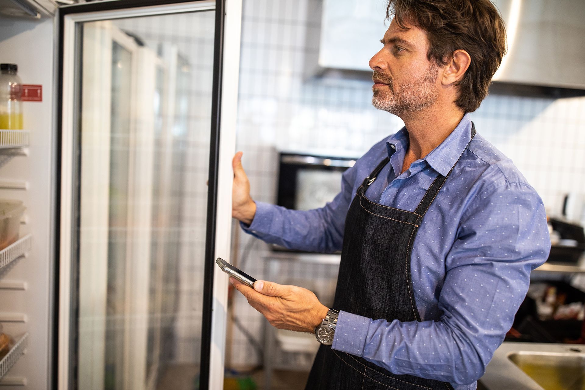 Man Looking at the Refrigerator — Sydney, NSW — Sharp Conditioning Solutions