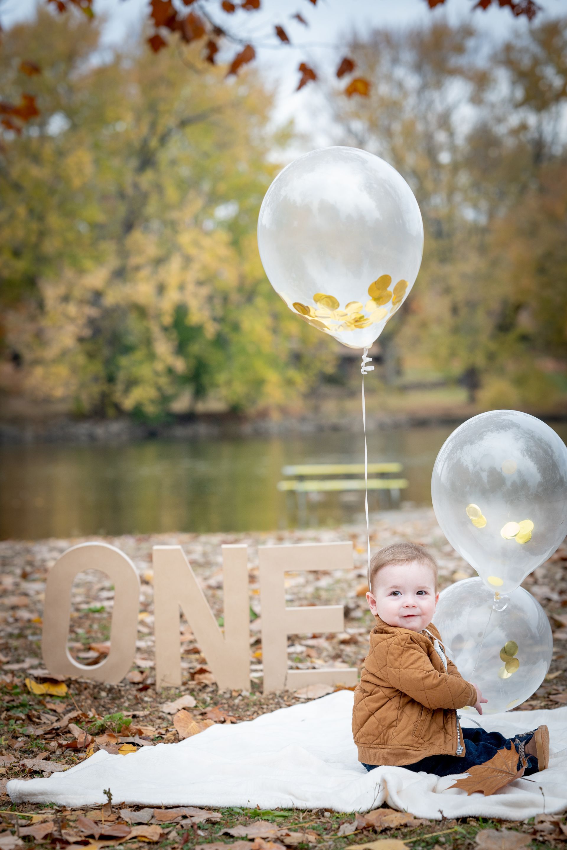 A baby sitting on a blanket with 